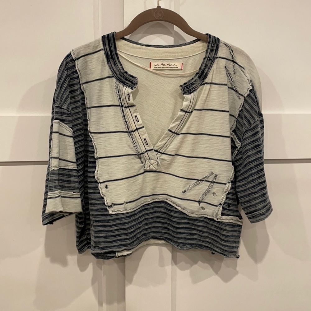 Distressed designer short sleeve shirt.